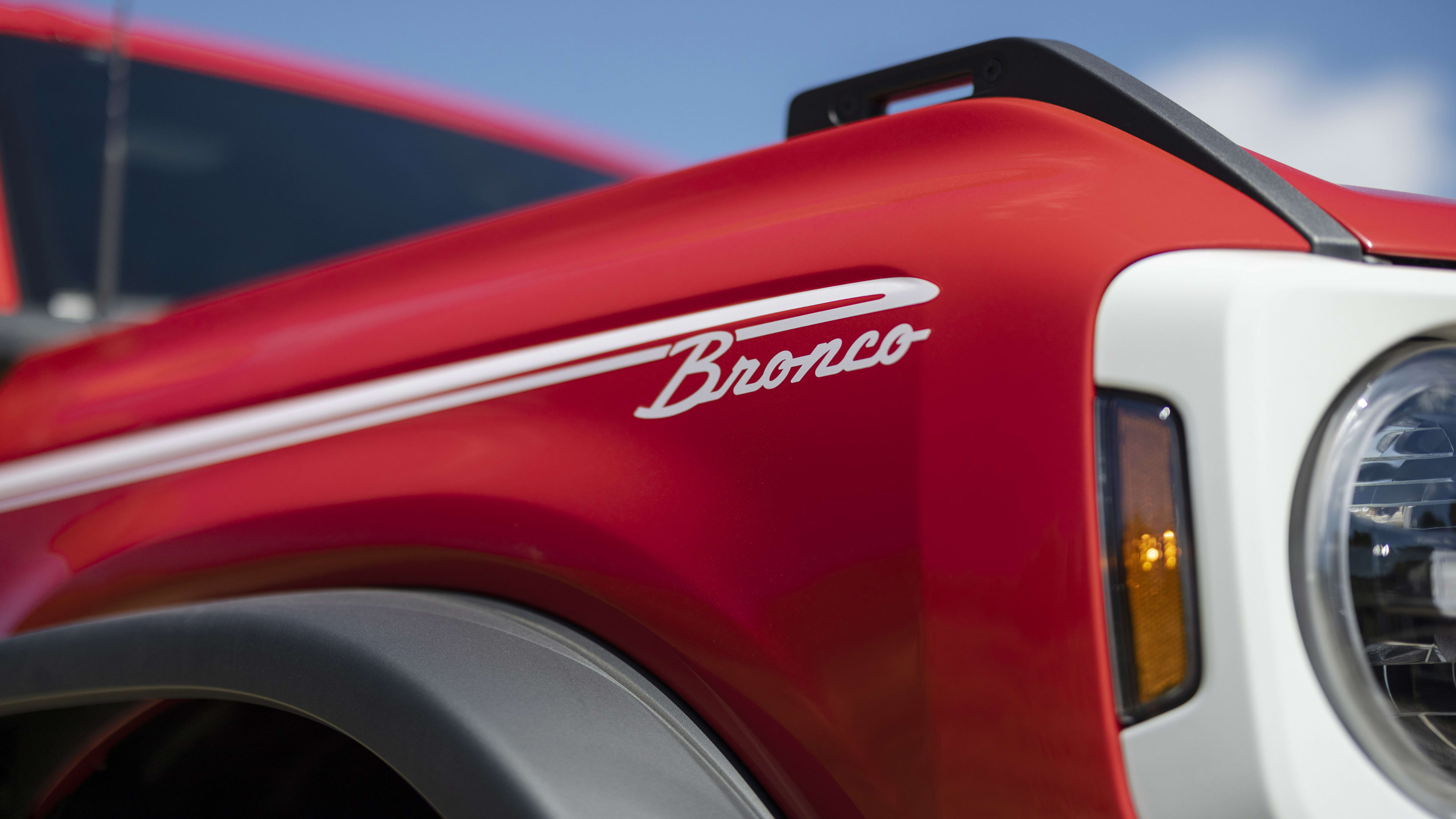 Bronco Heritage Edition available winter 2023. Limited availability. Preproduction models shown.  Always consult the Owner’s Manual before off-road driving, know your terrain and trail difficulty, and use appropriate safety gear.